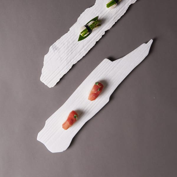 🔷 Fractured Form. Elevated Function.The Shard Sushi Plate by @borrowedearthcollaborative is an homage to the dramatic edges of broken stone—where form fractures into beauty.Designed with jagged contours and fine ridging, it turns sushi presentation into a sculptural experience—where elegance meets erosion.✨ Available in:🖤 Black Wave — a dark stone with deep veining and moody variation📏 Size: Freeform sushi-length slab💵 Price: $190.00📦 SKU: WM-SSPT-SH-BW-BEOEach Shard Plate is carved from reclaimed stone, making every piece one-of-a-kind in shape, striation, and story. Bold yet grounded, rugged yet refined.DM us to add one to your collection. For those who plate with intention.#BorrowedEarth #ShardPlate #BlackWaveStone #SushiDesign #StoneServeware #SculpturalDining #DesignWithEdge #WabiSabiAesthetic #PrecisionStone #TabletopArt